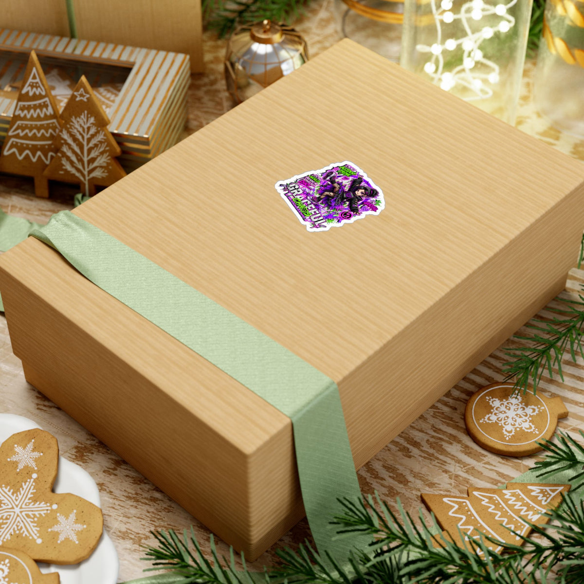 a box with a ribbon and ornaments