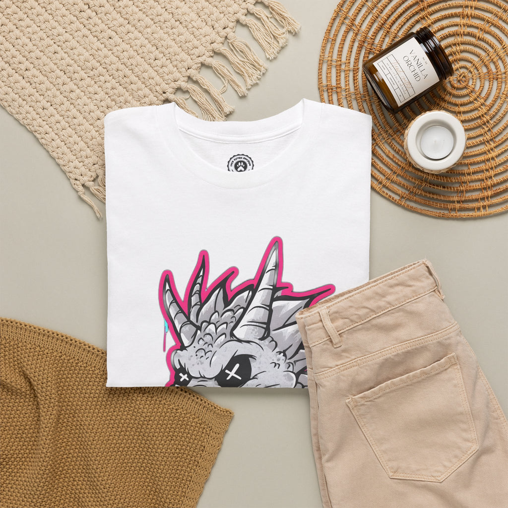 White t-shirt with graphic design on a beige surface with accessories