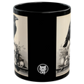 Gothic mug featuring a raven and skull design on a black background with a glossy finish.
