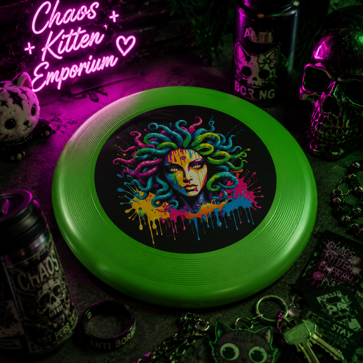 Colorful Medusa flying disc with a bright green rim and black center, featuring vibrant graffiti-inspired artwork.