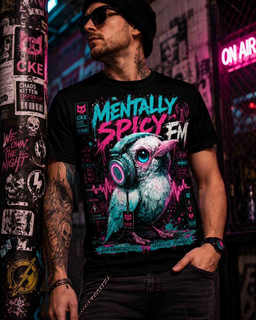 All-over print of Mentally Spicy Bird graphic T-shirt by Chaos Kitten Emporium, featuring a bold bird illustration on black fabric.