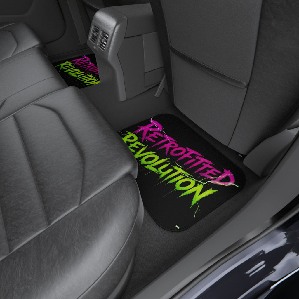 Set of four vibrant car mats featuring graffiti-style "Retrofitted Revolution" text and a bold steampunk design.