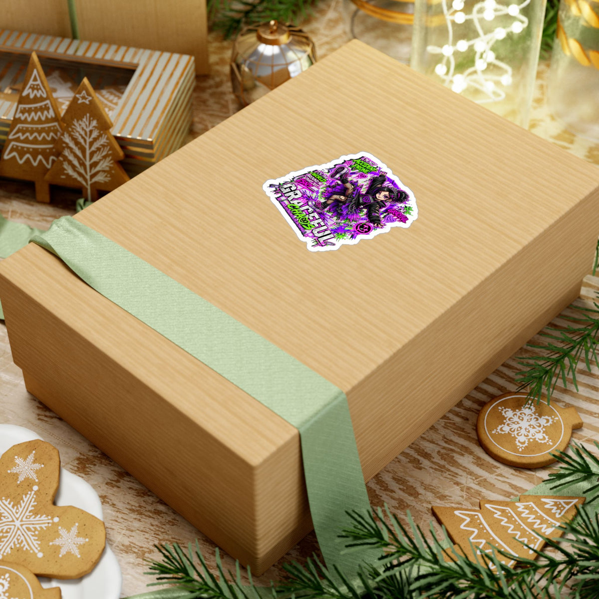 a box with a ribbon and ornaments