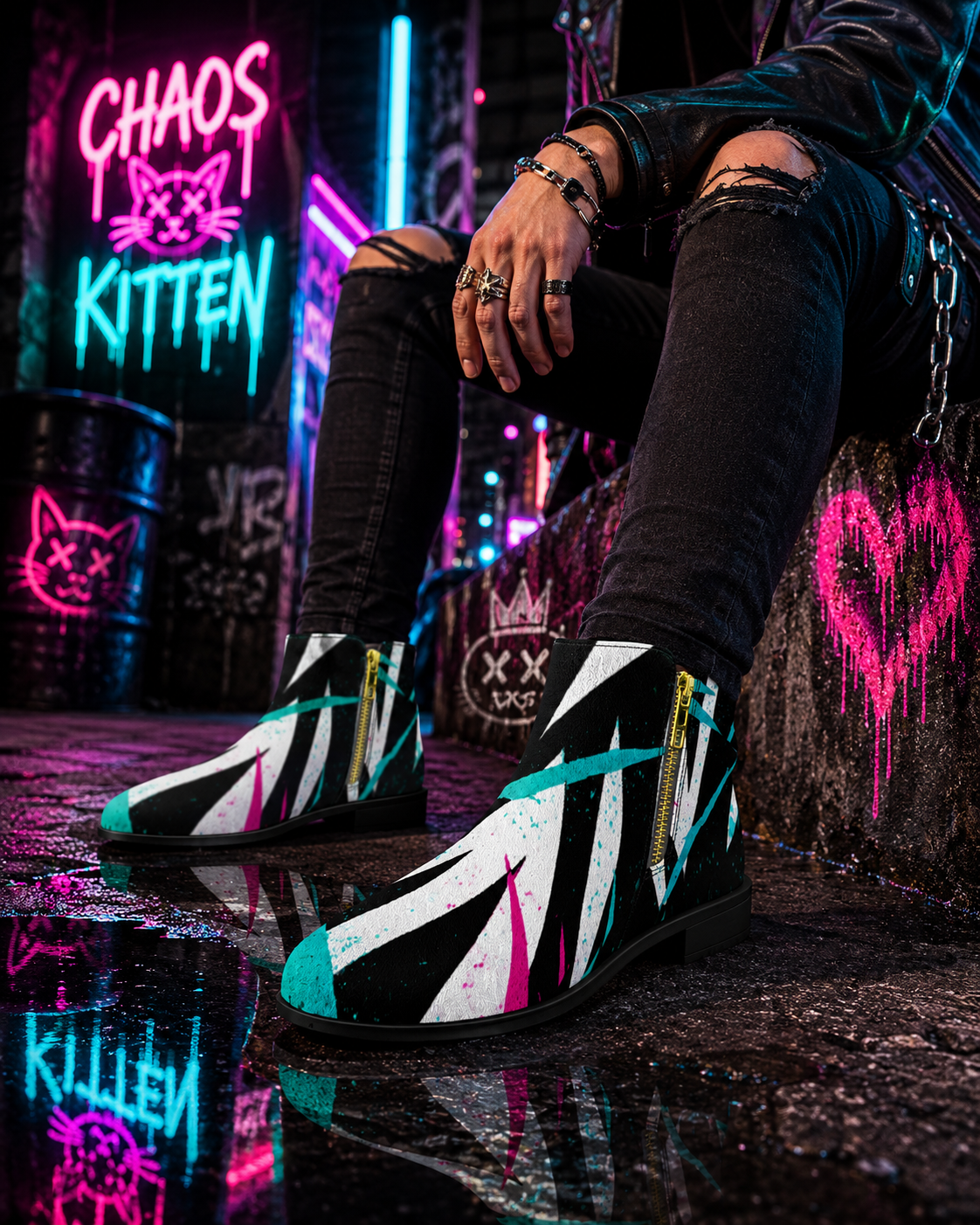 Black-and-white geometric boots with neon cyan and pink accents, featuring a sleek silhouette and zip closure.