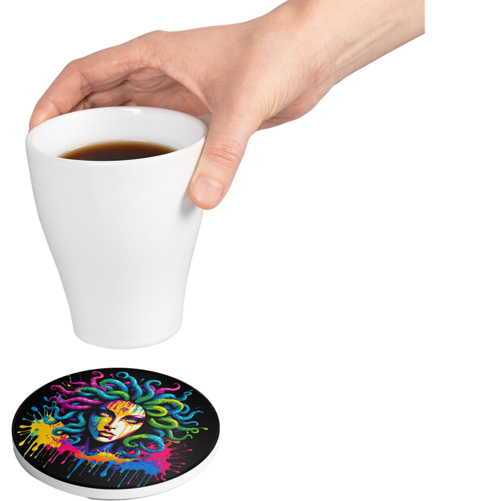 A hand holds a white cup above a colorful Medusa coaster featuring vibrant neon colors on a black background.